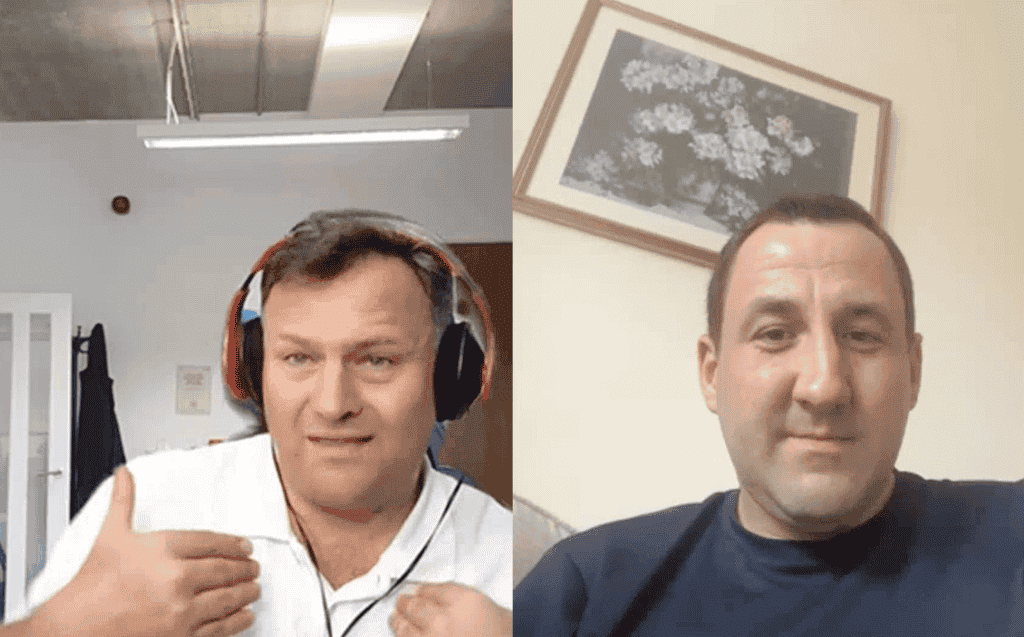 Two men in a video call, one with headphones, in a professional setting.